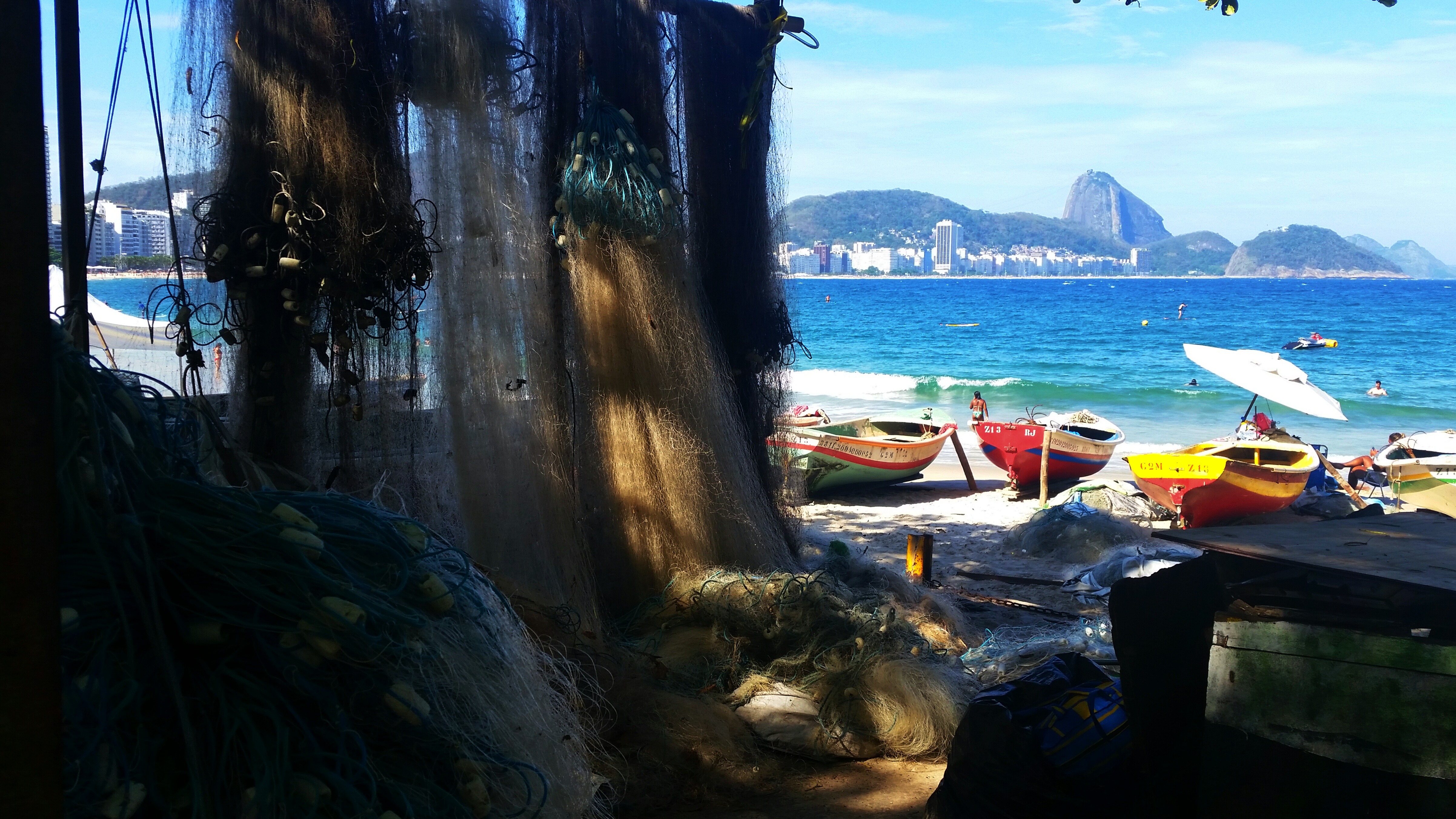 Colourful fishing boast and fishing nets at Copacabana Beach, Rio de Janeiro, Brazil