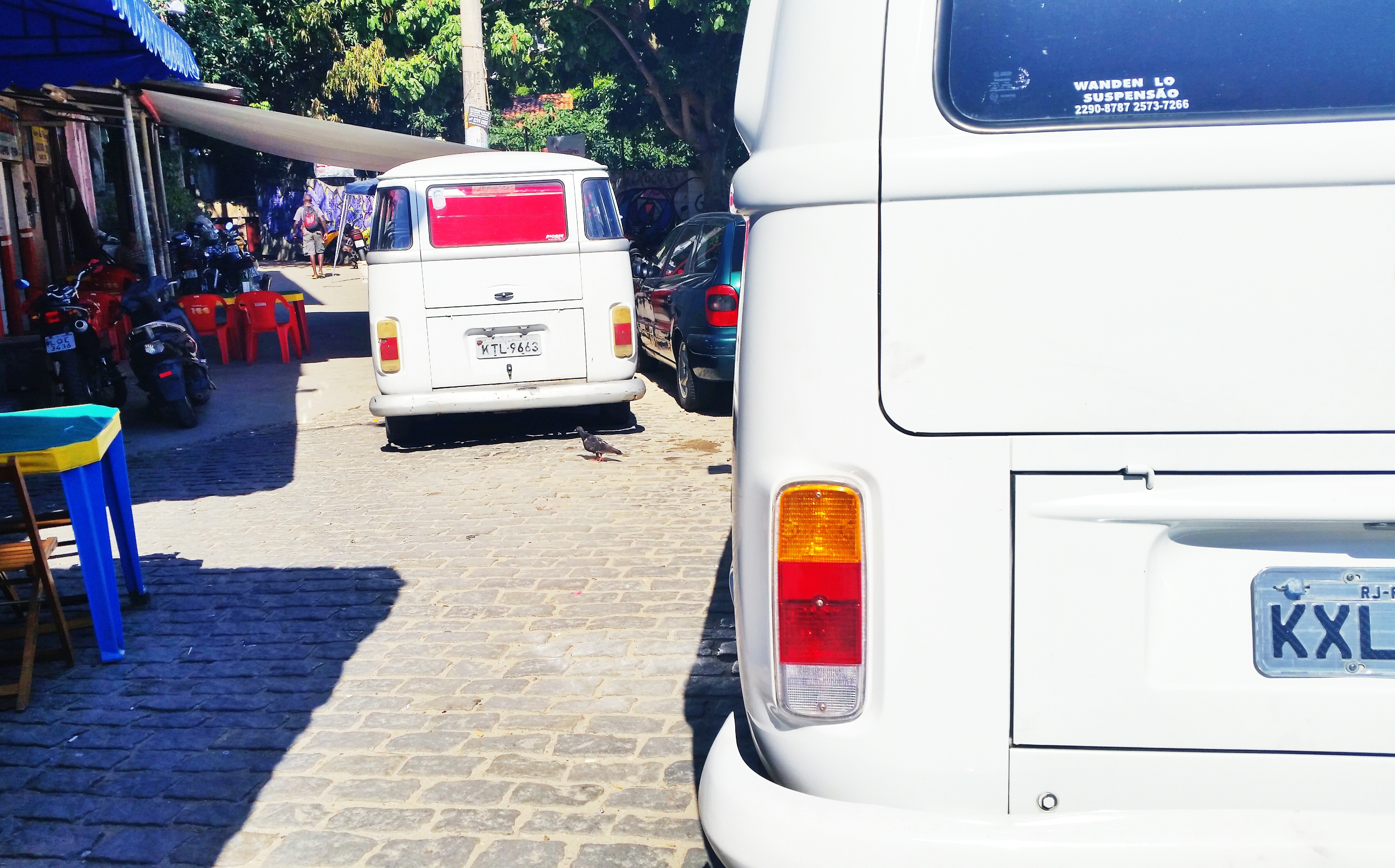 Is it safe for tourists to visit the favelas in Rio de Janeiro? - Hanging out at the local bar.