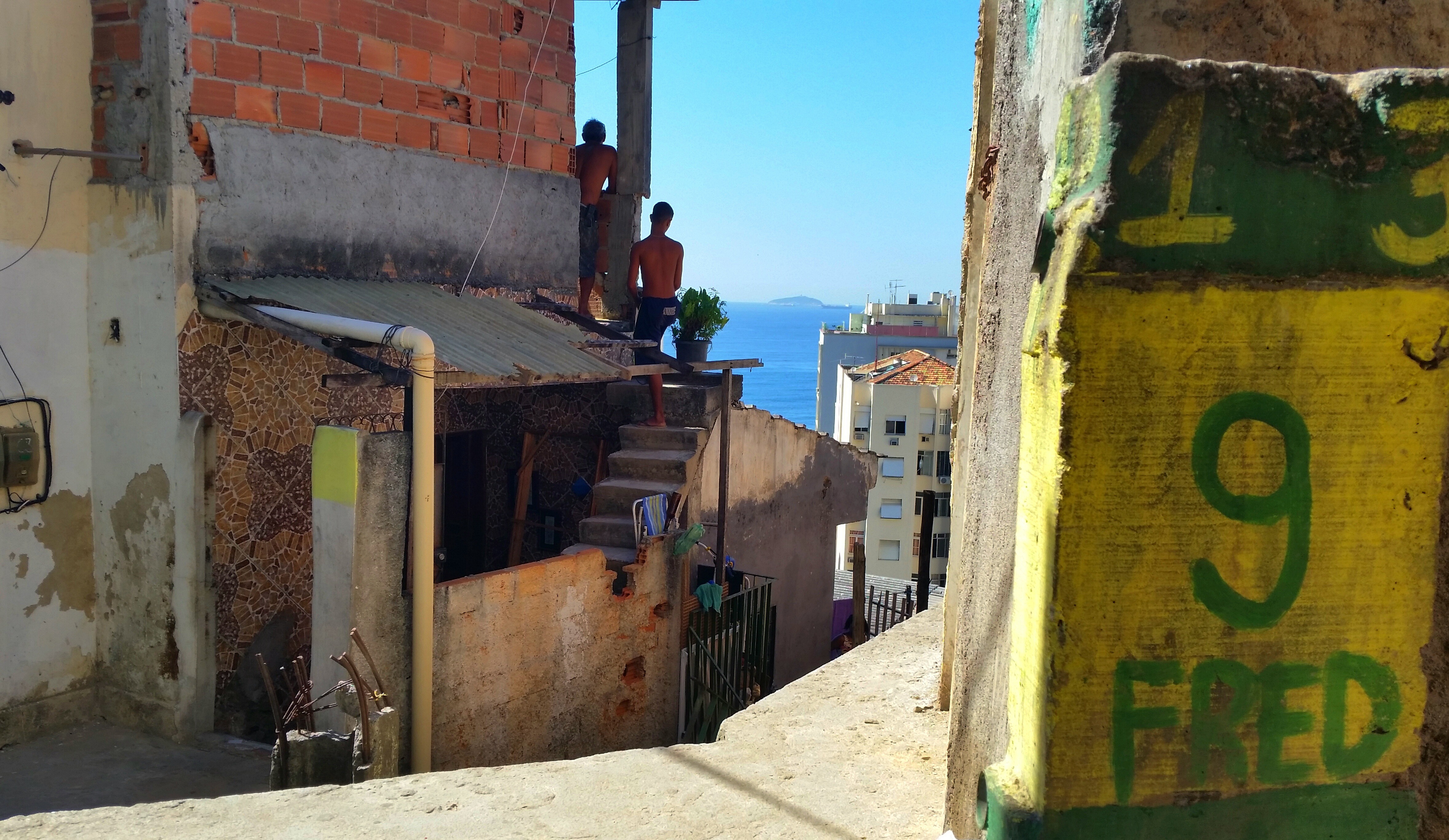 Is it safe for tourists to visit the favelas in Rio de Janeiro? - Boys hanging out in Chapéu Mangueira favela in Rio de Janeiro, Brazil