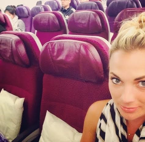 Alyssa flying Malaysia Airlines with next to no-one else on board (because it was the cheapest)