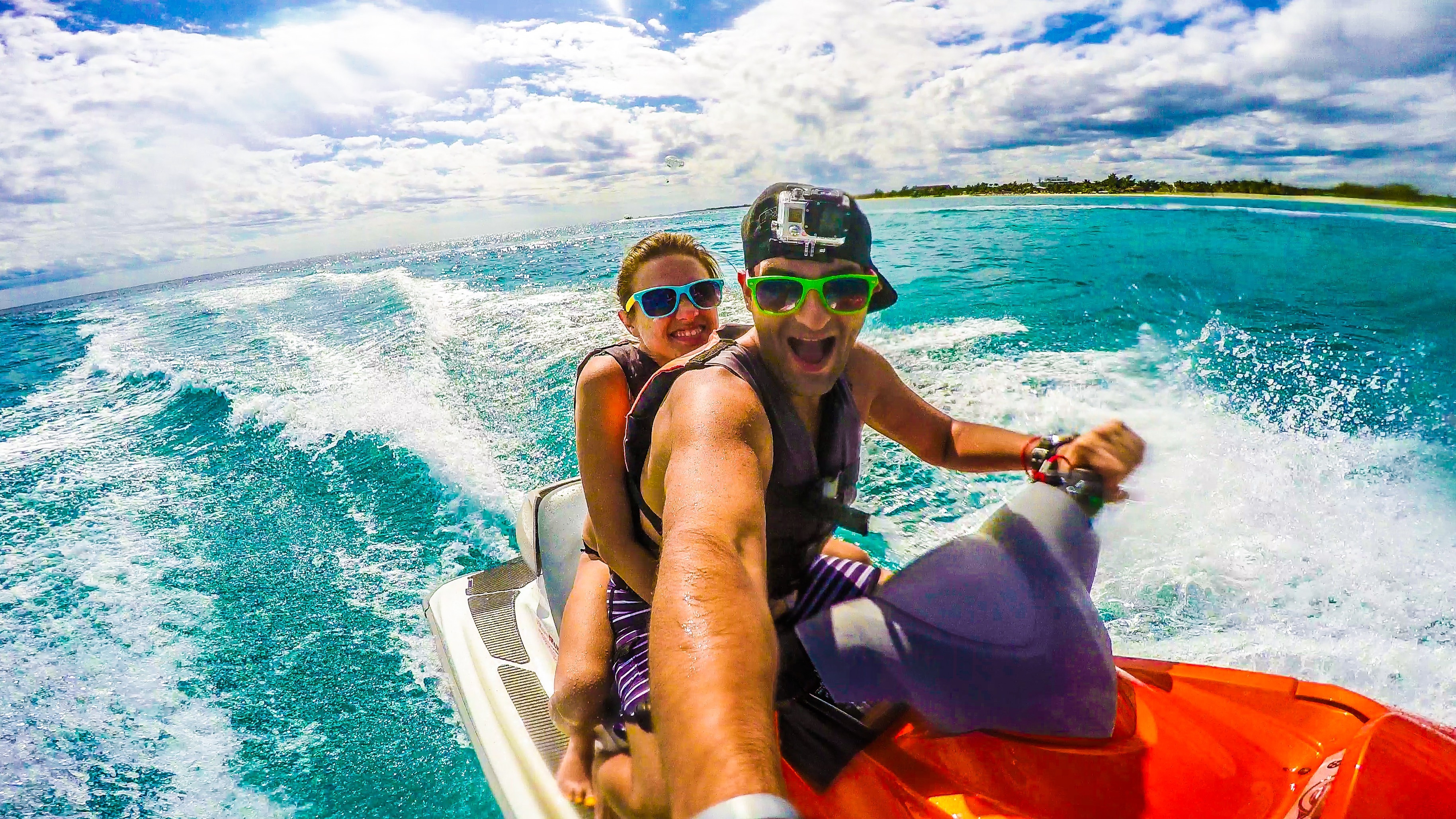 Vacation couple jet-skiing at the Grand Sunset Princess Hotel in the Mayan Riviera, Mexico