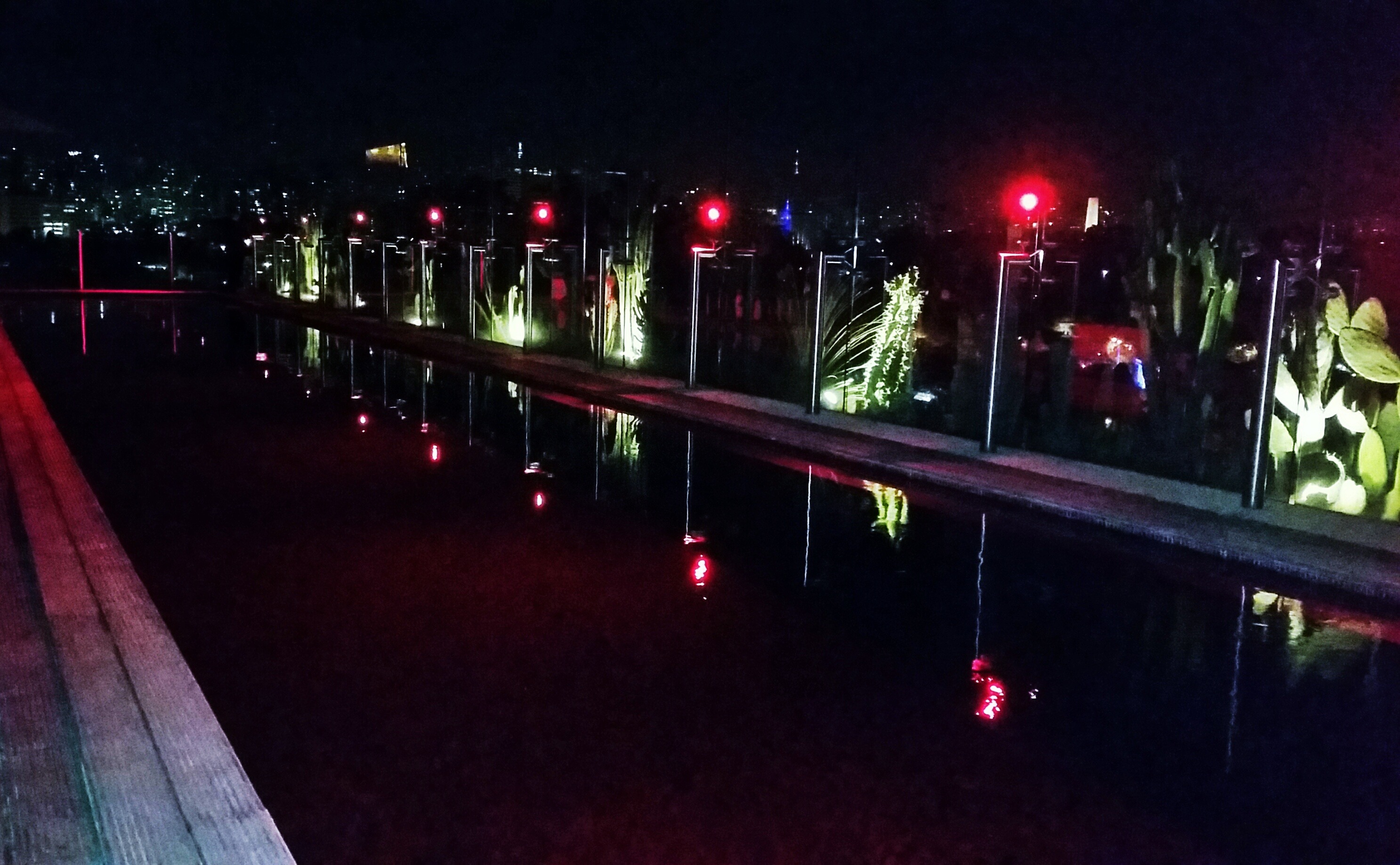 Crimson red rooftop swimming pool at the Skye Bar in São Paulo