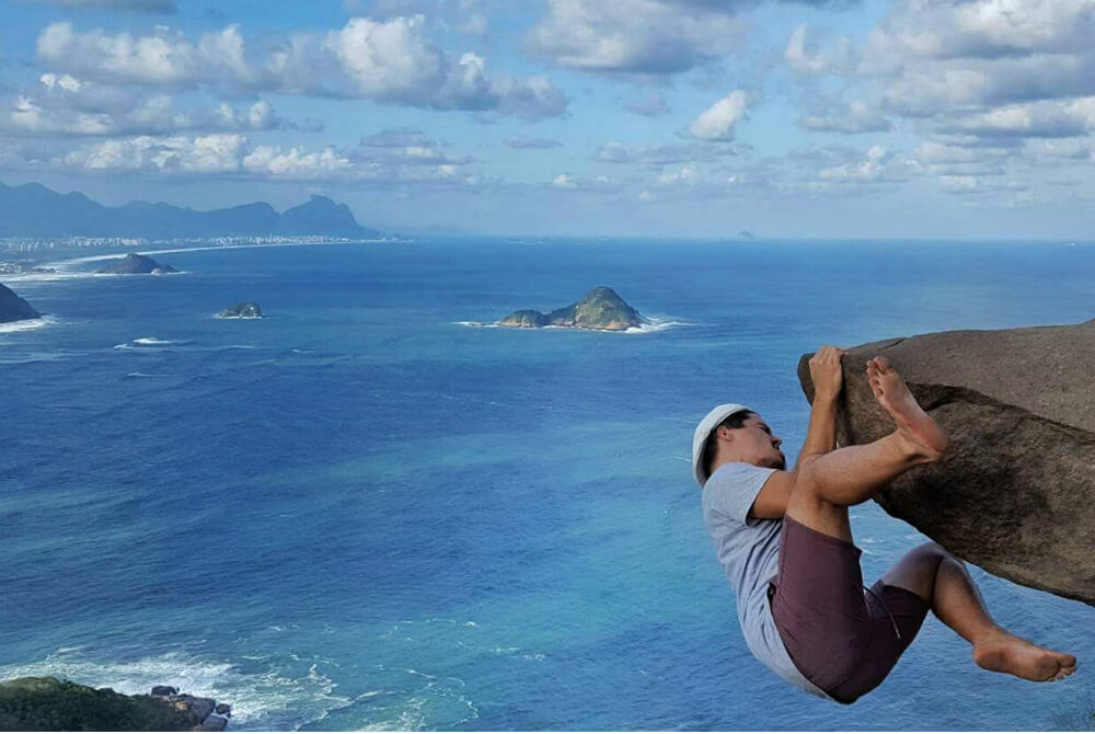 Hanging off the cliff | Kissing while hanging off the cliff | The breather point | The beginning of the walk | Barra de Guaratiba Rio de Janeiro | At the bus stop | The unique view over Rio de Janeiro | How To Get To Pedra Do Telegrafo, Rio De Janeiro (To Hang Off The Cliff)