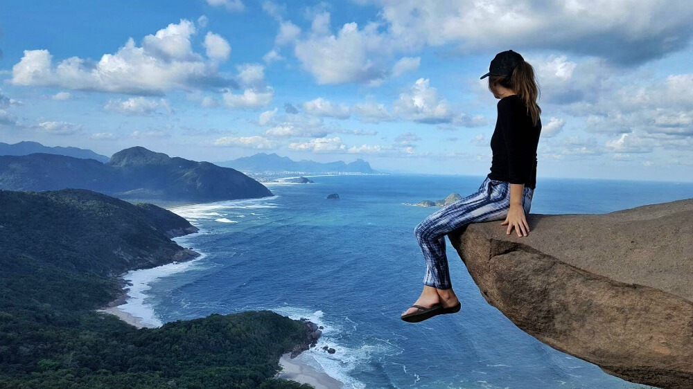 Sitting on the edge of the cliff | Hanging off the cliff | Kissing while hanging off the cliff | The breather point | The beginning of the walk | Barra de Guaratiba Rio de Janeiro | At the bus stop | The unique view over Rio de Janeiro | How To Get To Pedra Do Telegrafo, Rio De Janeiro (To Hang Off The Cliff)