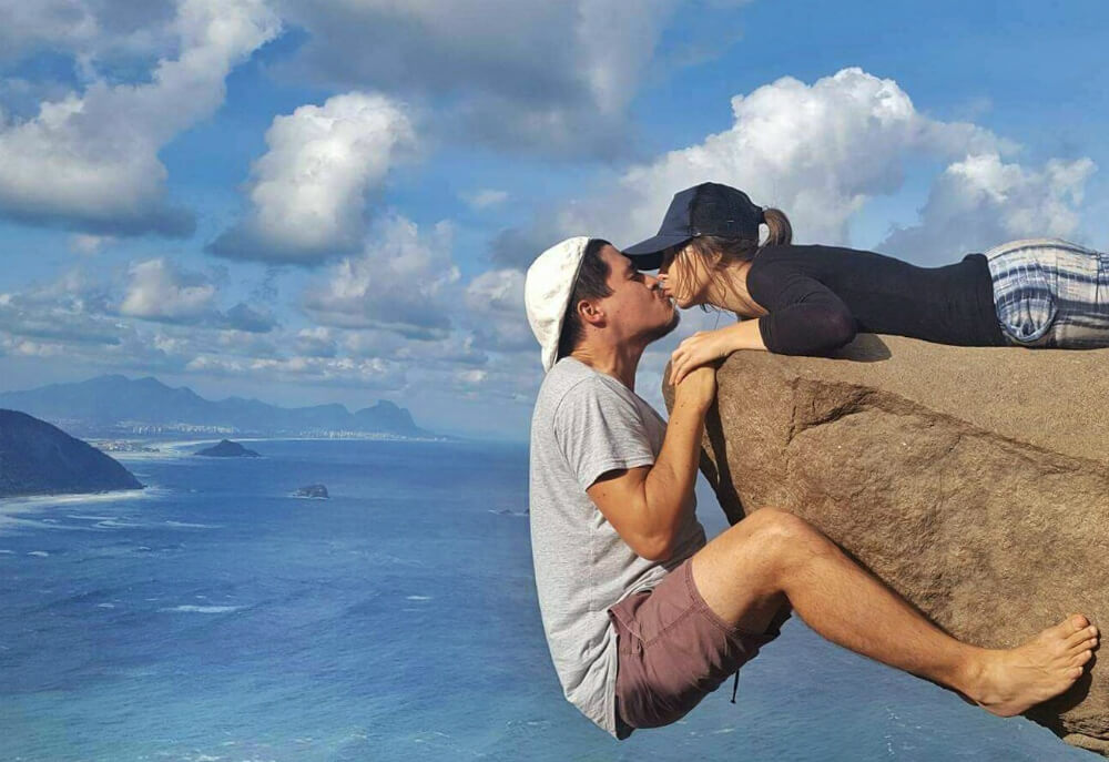 Kissing while hanging off the cliff | The breather point | The beginning of the walk | Barra de Guaratiba Rio de Janeiro | At the bus stop | The unique view over Rio de Janeiro | How To Get To Pedra Do Telegrafo, Rio De Janeiro (To Hang Off The Cliff)