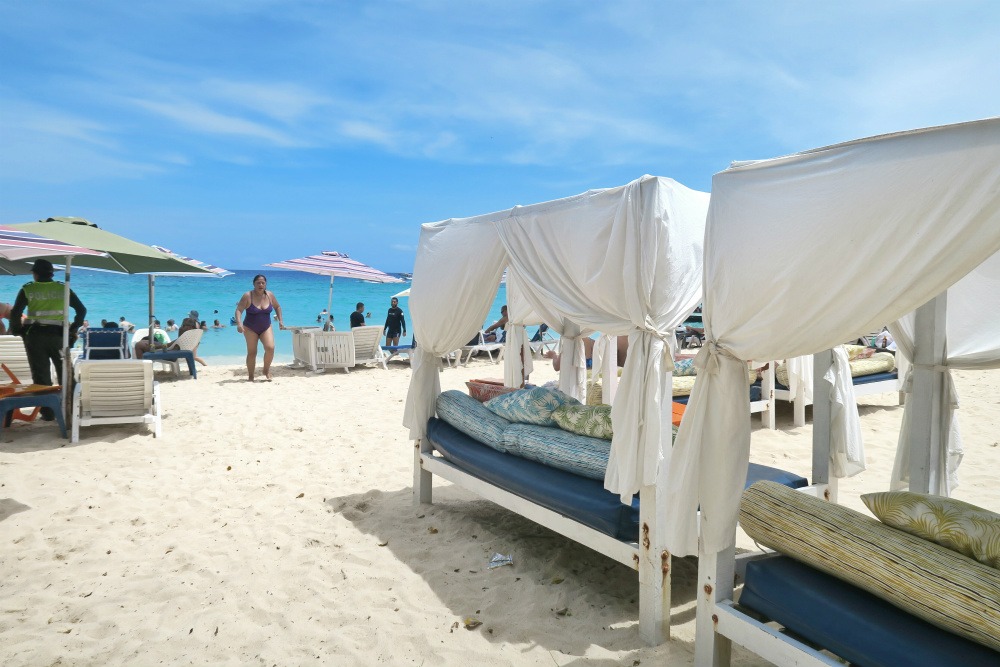 Day beds at Playa Blanca | What To Expect On A Day Trip To Playa Blanca Colombia