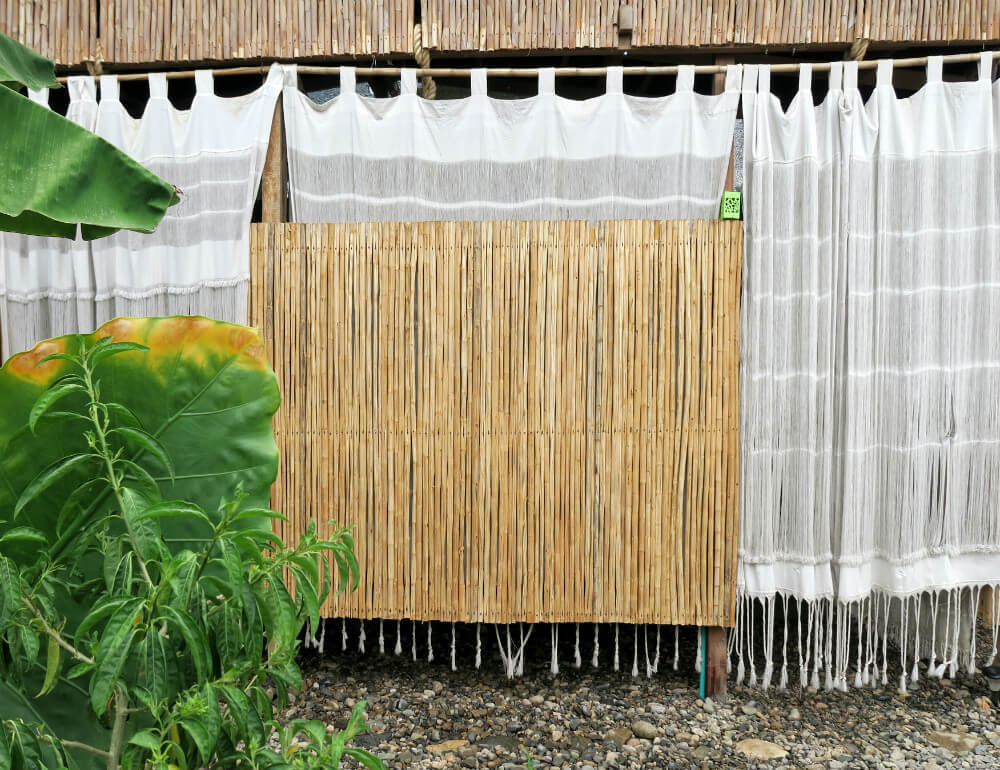 Our indoor-outdoor bedroom at TRIBE Guesthouse Palomino, Colombia | A Private Oasis: Sleep In The Clouds At TRIBE Guesthouse Palomino, Colombia