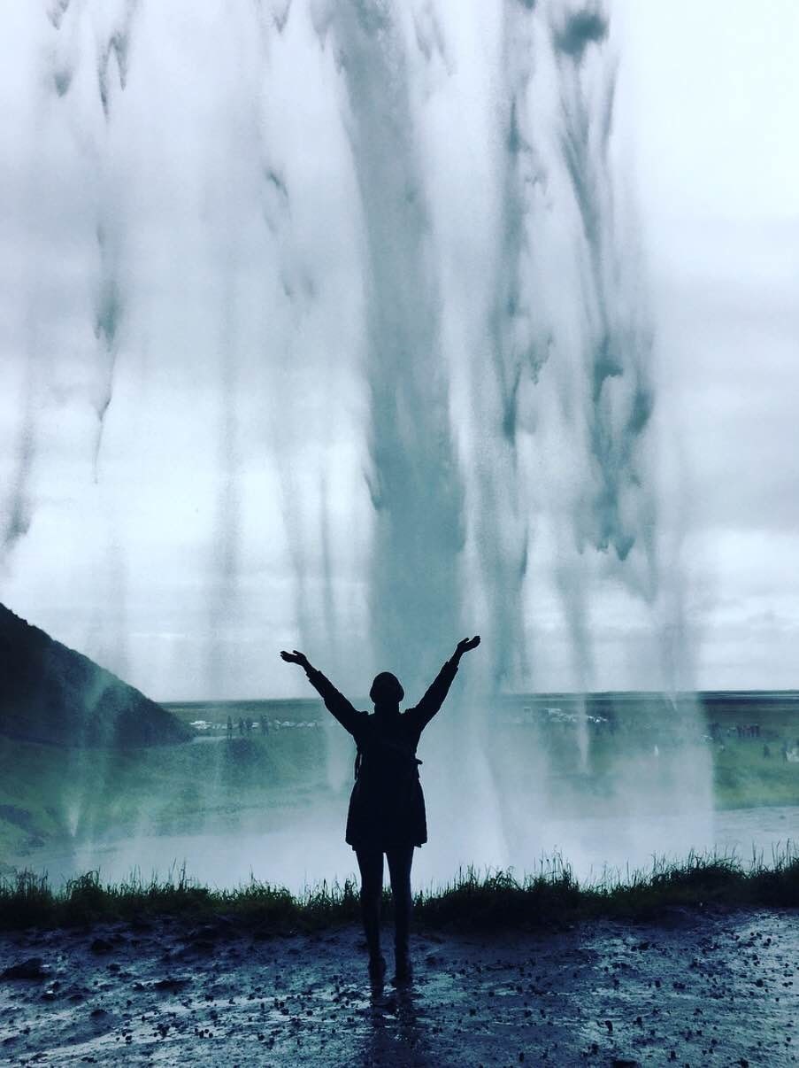 Standing behind the cave at Seljalandsfoss waterfalls - Iceland Travel Itinerary: How To Experience The Best Of Iceland In 3 days