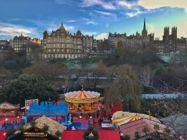 The Christmas market with Old Town in the background - Edinburgh travel tips