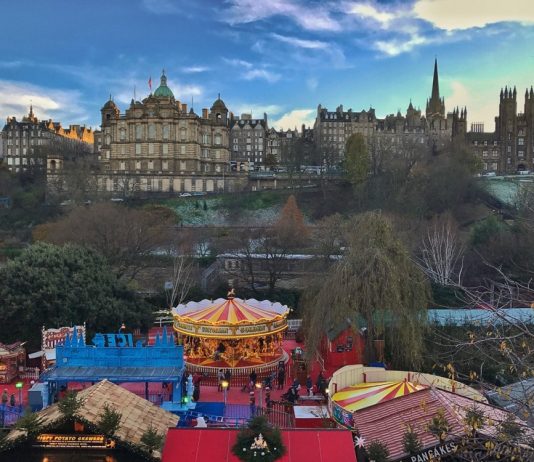 The Christmas market with Old Town in the background - Edinburgh travel tips