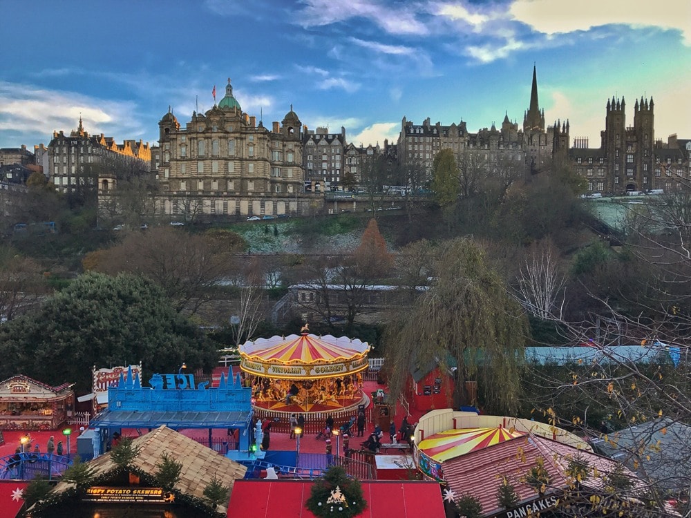 The Christmas market with Old Town in the background - Edinburgh travel tips