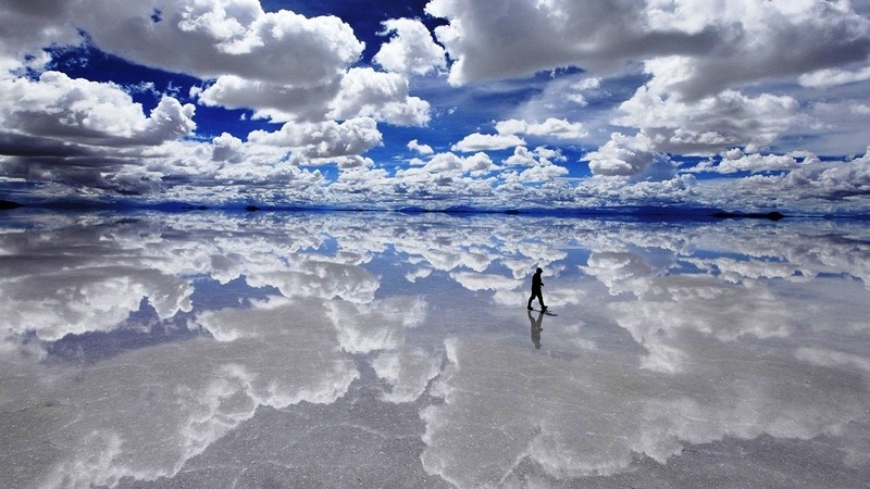 Weird places in the world - mirror-like reflection of the sky on a flooded salt flat