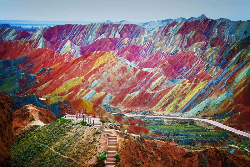 Weird places in the world - mesmerizing mountain ranges lined with streaks of red, blue, yellow, and green