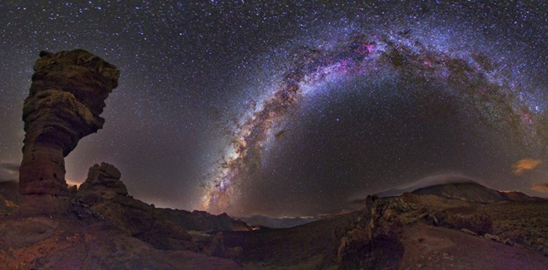 Weird places in the world - a galaxy of stars forming an arch as seen above Mt. El Teide