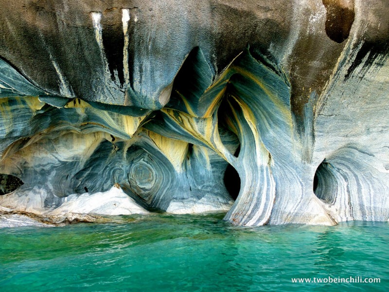 The oddly beautiful swirls of blue inside the caves are thre results of calcium carbonate weathering