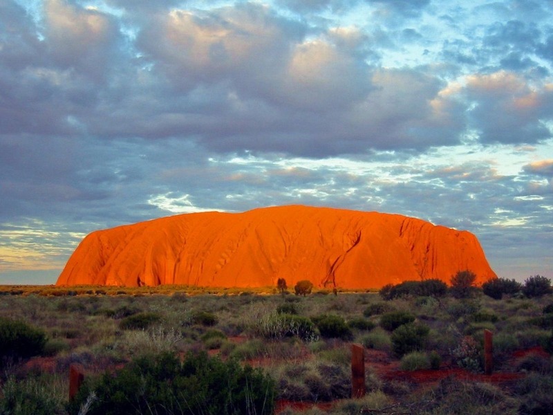 Shades of the World Series: Uluru Rock glows bright orange during sunset period