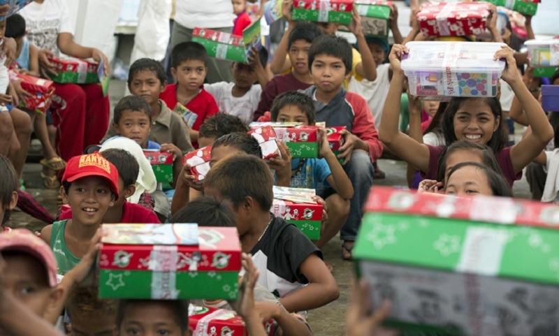 Filipino kids receiving Christmas gifts