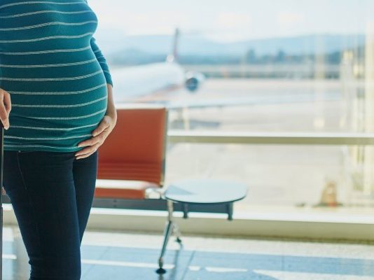 traveling pregnant woman