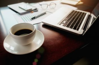 business-concept-with-copy-space-office-desk-table-with-pen-focus-analysis-chart-computer-notebook-cup-coffee-desk-vintage-tone-retro-filter-selective-focus_1418-667